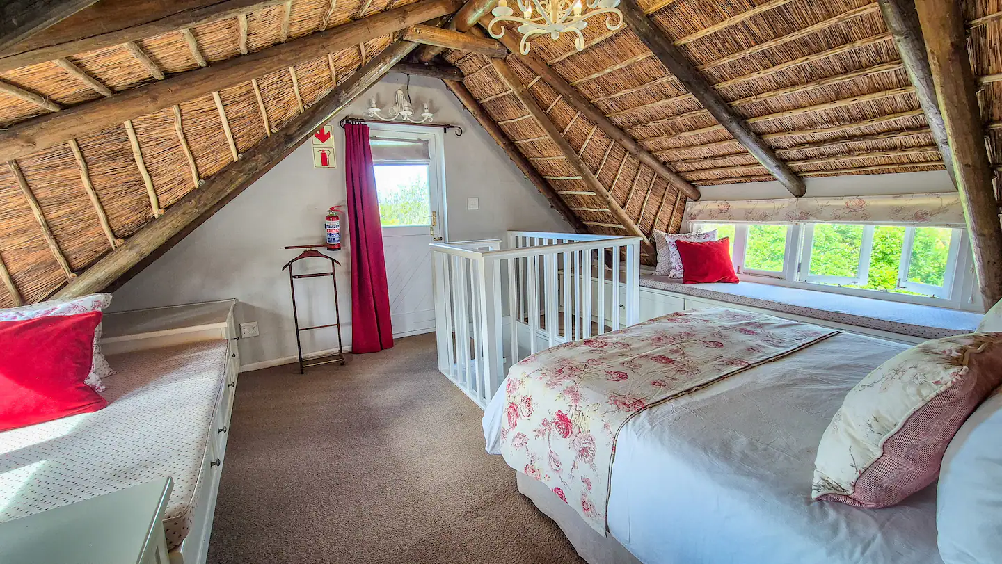 Second loft bedroom with window seat