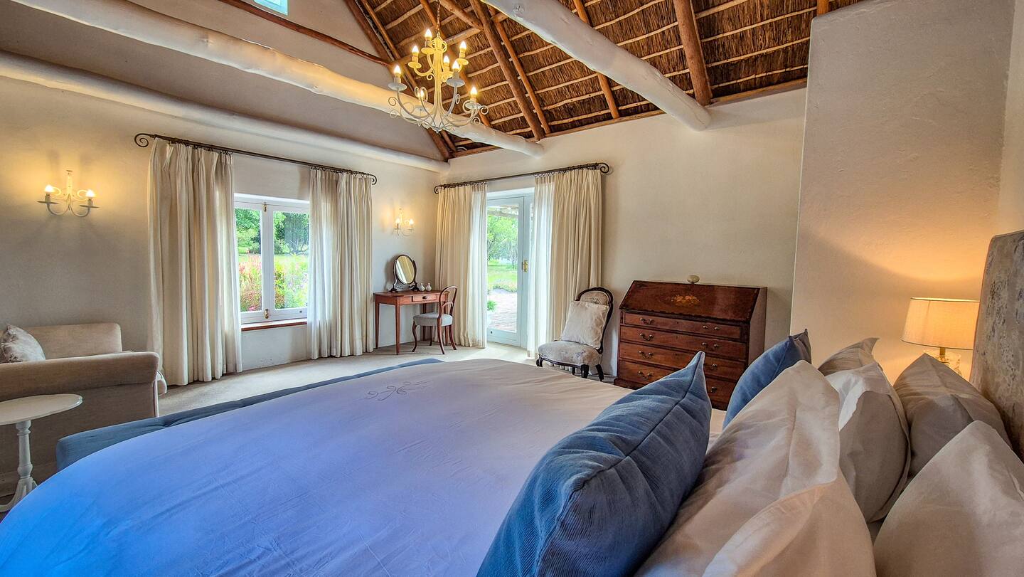 Main bedroom with doors to the garden