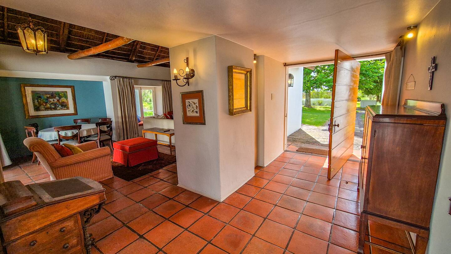 Entrance hall with the front door open to the garden